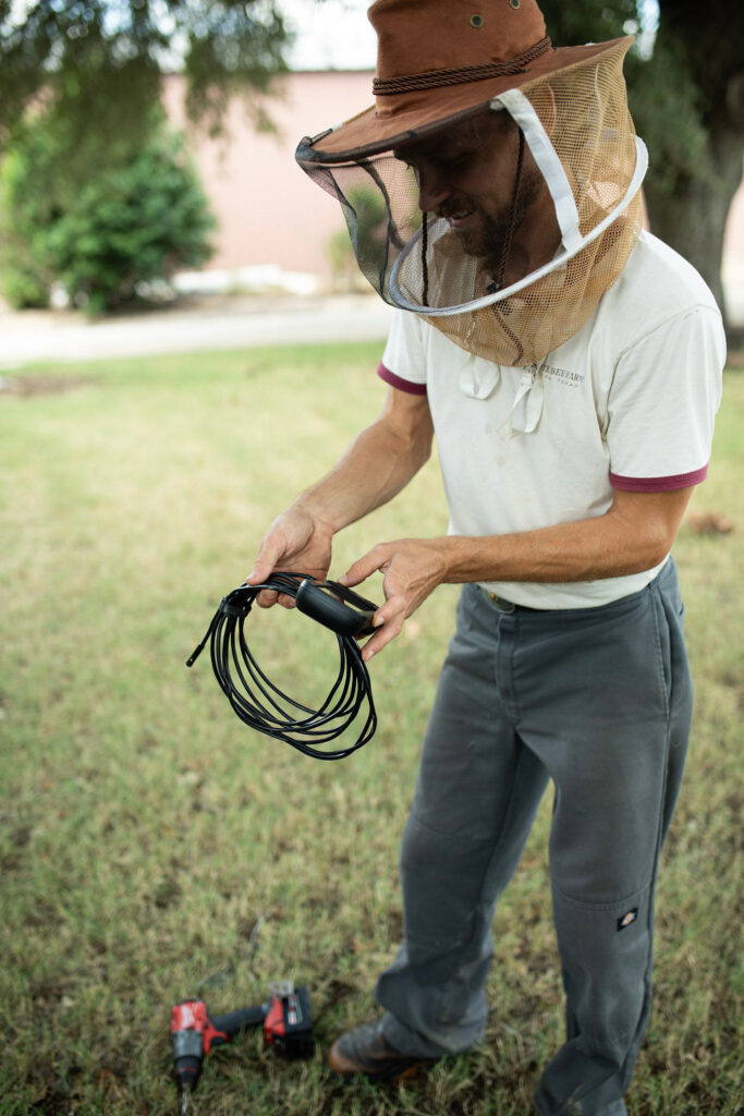 Beekeeper assessing were bees might be at a house in Temple TX